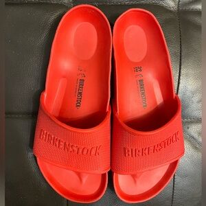 Size 39, red foam Birkenstock sandals. Previously worn, very good condition.